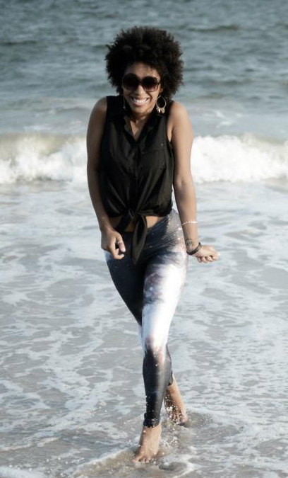Jasmine smiling and walking in the ocean